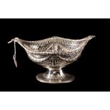 A VICTORIAN SILVER OPEN PIERCED BASKET, with chains of husk decoration,