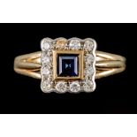 A DIAMOND AND SAPPHIRE CLUSTER RING, the