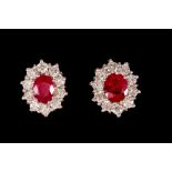 A PAIR OF RUBY AND DIAMOND CLUSTER EARRINGS, two oval cut rubies of approx. 2.