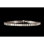 A DIAMOND LINE BRACELET, the emerald cut