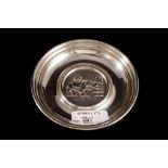 A MODERN IRISH SILVER DISH, by Douglas Bennett, depicting The Flight into Egypt,