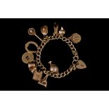 A 9CT GOLD CHARM BRACELET,