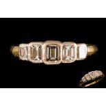 A DIAMOND FIVE STONE RING, with graduated emerald cut diamonds of approx.