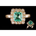 A LATE VICTORIAN EMERALD AND DIAMOND CLUSTER RING, one cushion cut emerald of approx. 2.