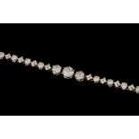 A DIAMOND LINE BRACELET, three round brilliant cut diamonds of approx 6.