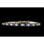 AN ART DECO SAPPHIRE AND DIAMOND BRACELET, with square step cut sapphires of approx. 2.