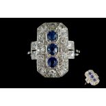 AN EARLY 20TH CENTURY SAPPHIRE AND DIAMOND PLAQUE RING, with sapphires of approx. 0.