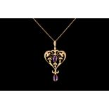 AN EDWARDIAN 15CT GOLD AMETHYST AND SEED