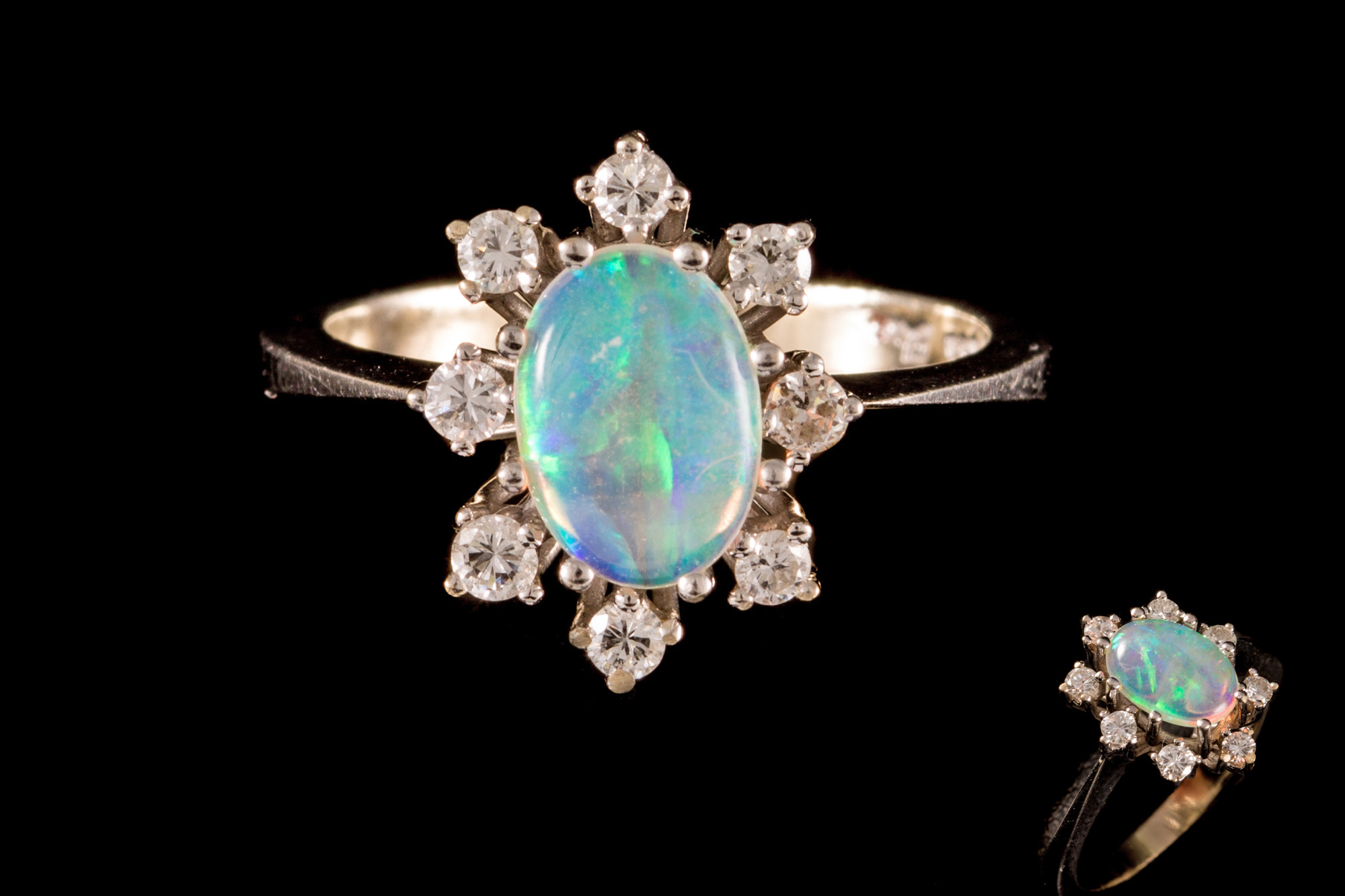 AN OPAL AND DIAMOND CLUSTER RING, with opal of approx. 0.70ct, diamonds of approx. 0.