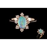AN OPAL AND DIAMOND CLUSTER RING, with opal of approx. 0.70ct, diamonds of approx. 0.