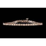 A DIAMOND LINE BRACELET, the brilliant cut diamonds of approx. 5.