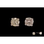 A PAIR OF DIAMOND STUD EARRINGS, the brilliant cut diamonds of approx. 0.