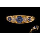 A SAPPHIRE AND DIAMOND FIVE STONE RING, with sapphires of approx. 0.