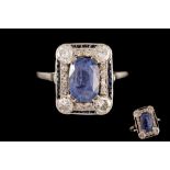 A SAPPHIRE AND DIAMOND PLAQUE RING, with central sapphire of approx. 3.30ct, diamonds of approx. 0.