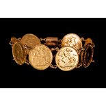 A HALF SOVEREIGN LINK BRACELET, with eight half sovereign coin links and floral engraved box clasp.