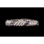 A SAPPHIRE AND DIAMOND BRACELET BY MOUAWAD, set throughout with marquise cut sapphires of approx. 3.