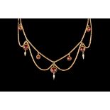 AN EDWARDIAN GARNET SET NECKLACE.