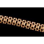 AN 18CT GOLD SIX ROW CUFF STYLE BRACELET.