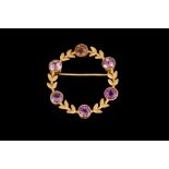 AN AMETHYST WREATH BROOCH, mounted on 9c