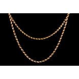 A VICTORIAN 9CT GOLD MUFF CHAIN