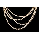 A LONG GRADUATED CULTURED PEARL NECKLACE