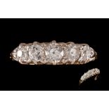 A VICTORIAN DIAMOND CARVED DRESS RING, with five old cut diamonds of approx. 1.