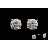 A PAIR OF DIAMOND SOLITAIRE STUD EARRINGS, two round brilliant cut diamonds of 1.