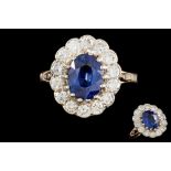 A SAPPHIRE AND DIAMOND OVAL CLUSTER RING, with one oval cut sapphire of approx. 2.
