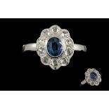 A SAPPHIRE AND DIAMOND CLUSTER RING, with rose cut diamonds,