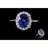 A TANZANITE AND DIAMOND CLUSTER RING,