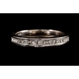 A DIAMOND HALF ETERNITY RING,