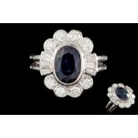 A SAPPHIRE AND DIAMOND OVAL CLUSTER RING, one oval sapphire of approx. 3.