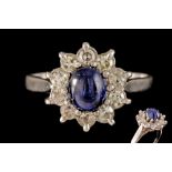 A SAPPHIRE AND DIAMOND CLUSTER RING,