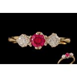 A RUBY AND DIAMOND THREE STONE RING,