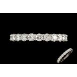 A DIAMOND FULL ETERNITY RING BY TIFFANY, with round brilliant cut diamonds of approx. 2.