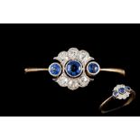A SAPPHIRE AND DIAMOND DRESS RING, with three round sapphires of approx. 0.