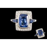 A SAPPHIRE AND DIAMOND CLUSTER RING, one cushion cut sapphire of 4.