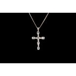 AN AQUAMARINE AND DIAMOND CROSS, mounted in white gold,