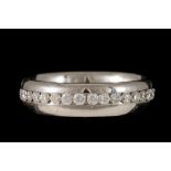 A DIAMOND ETERNITY RING, mounted in palladium,