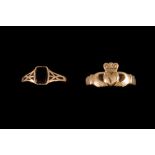 A 9CT GOLD CLADDAGH DRESS RING; together with an onyx set dress ring,