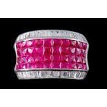 A FOUR ROW PAVE SET RUBY DRESS RING, with baguette cut diamond shoulder,