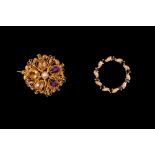 A 15CT YELLOW GOLD FILIGREE BROOCH, set with amethyst,