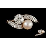 AN ANTIQUE DIAMOND AND PEARL TWIST RING, with diamond shoulders,