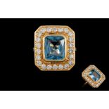 A BLUE TOPAZ AND DIAMOND CLUSTER RING,