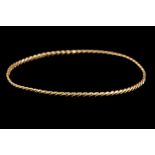 AN 18CT YELLOW GOLD TWISTED BANGLE