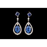 A PAIR OF SAPPHIRE AND DIAMOND DROP EARRINGS, with oval and square step cut sapphires of approx. 6.