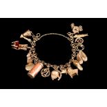 A GOLD CHARM BRACELET,