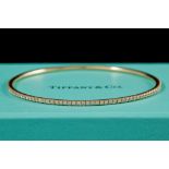 A TIFFANY & CO DIAMOND 'METRO' BANGLE, of approx. 1.