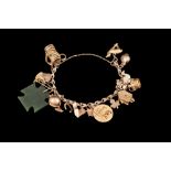 A GOLD CHARM BRACELET,