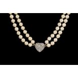 A CULTURED PEARL NECKLACE, two row uniform necklace with diamond pavé heart shape pendant.